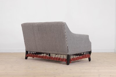 Lot 57 - An ebonised wooden sofa by OKA