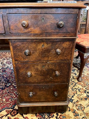 Lot 87 - A Victorian walnut twin-pedestal desk