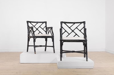Lot 26 - A pair of ebonised bamboo ‘cockpen’ elbow chairs