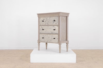 Lot 24 - A painted wooden and verre églomisé chest of drawers by OKA