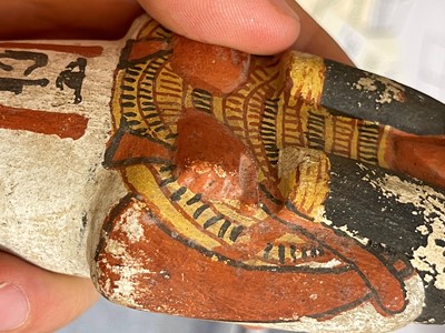 Lot 666 - An Egyptian painted limestone ushabti