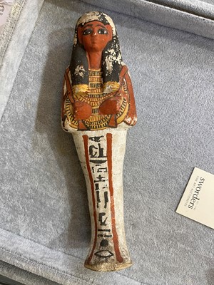 Lot 666 - An Egyptian painted limestone ushabti