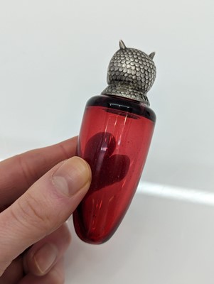 Lot 41 - A Victorian silver-mounted glass scent bottle