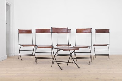 Lot A set of six iron and leather folding chairs