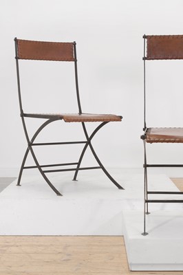 Lot 204 - A set of six iron and leather folding chairs
