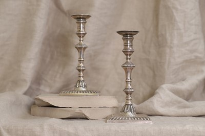 Lot 496 - A pair of George III silver tapersticks