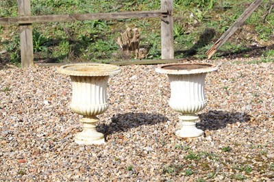 Lot 453 - A pair of painted cast iron garden urns