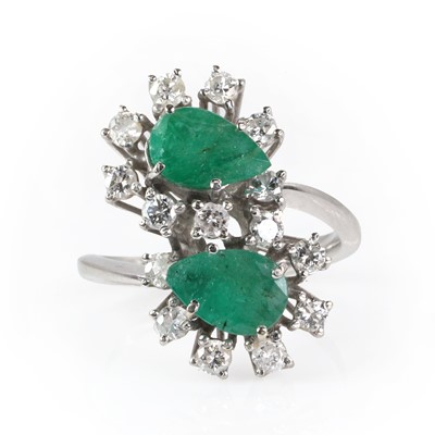 Lot 181 - A diamond and emerald cluster ring, c.1960-70
