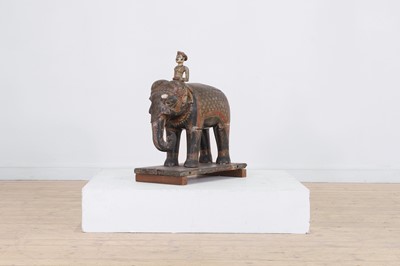 Lot 310 - A carved, lacquered and painted wooden elephant