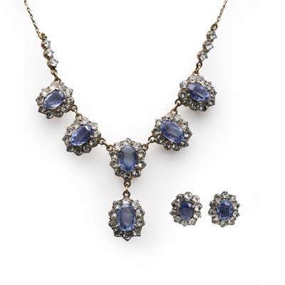 Lot 268 - A blue and white sapphire cluster, necklace and earring suite