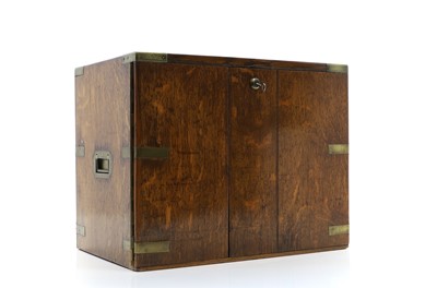 Lot 329 - An oak and brass bound three-drawer cabinet