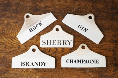 Lot 130 - A group of five ceramic wine bin labels