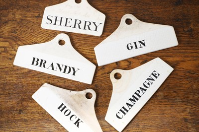 Lot 130 - A group of five ceramic wine bin labels