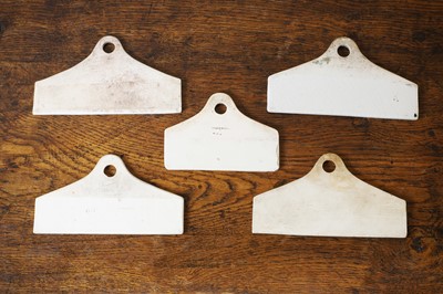 Lot 130 - A group of five ceramic wine bin labels