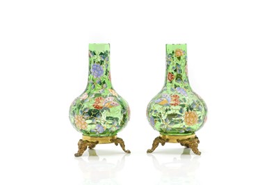 Lot 243 - A pair of Moser green glass and gilt-metal bottle vases