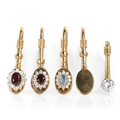 Lot 362 - A group of five gold and silver gilt gem set napkin clips