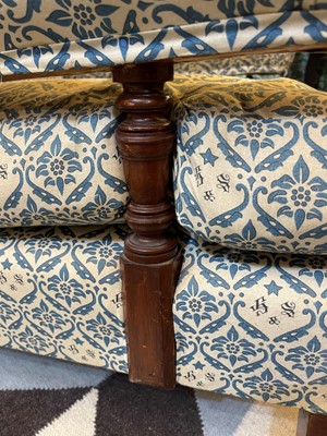 Lot 104 - A pair of open armchairs by Howard & Sons