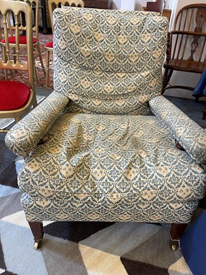 Lot 104 - A pair of open armchairs by Howard & Sons