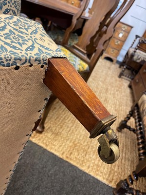Lot 104 - A pair of open armchairs by Howard & Sons