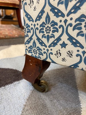 Lot 104 - A pair of open armchairs by Howard & Sons