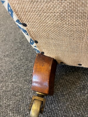 Lot 104 - A pair of open armchairs by Howard & Sons