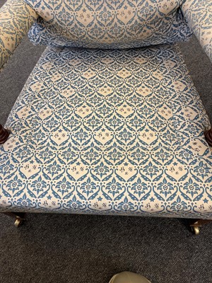 Lot 104 - A pair of open armchairs by Howard & Sons