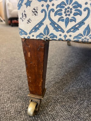 Lot 104 - A pair of open armchairs by Howard & Sons