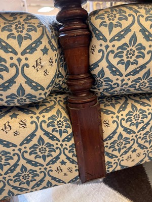Lot 104 - A pair of open armchairs by Howard & Sons