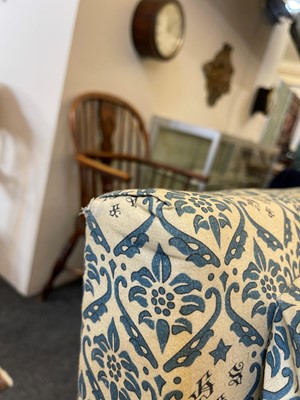 Lot 104 - A pair of open armchairs by Howard & Sons
