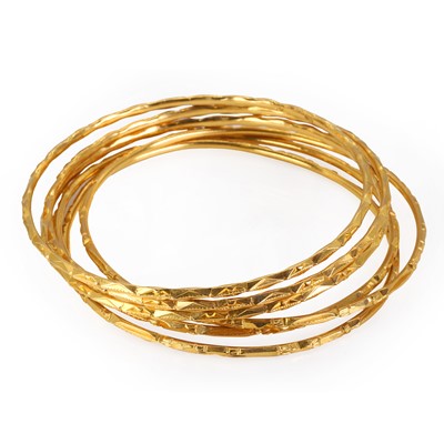 Lot 250 - A group of six high carat gold bangles