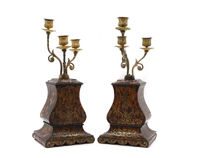 Lot 150 - A pair of tortoiseshell candelabra