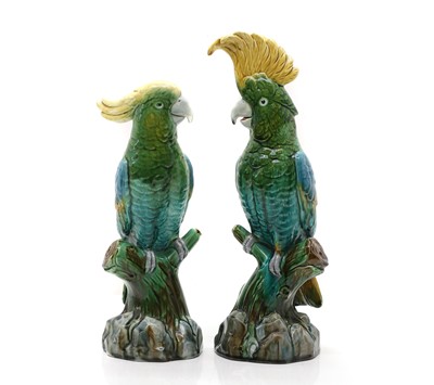 Lot 95 - A pair of majolica glazed pottery cockatoos