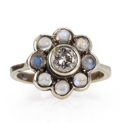 Lot 167 - A 9ct gold diamond and moonstone cluster ring