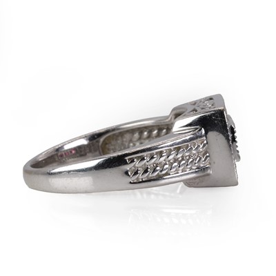 Lot 233 - A white gold diamond and rhodolite garnet ring