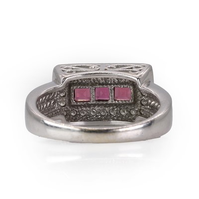 Lot 233 - A white gold diamond and rhodolite garnet ring