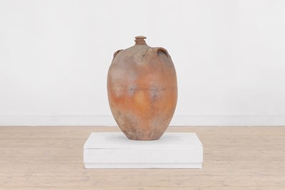 Lot 174 - A terracotta oil pot