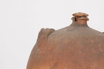 Lot 174 - A terracotta oil pot
