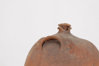 Lot 174 - A terracotta oil pot