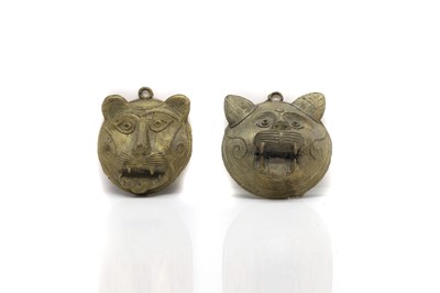 Lot 153 - A pair of Indian brass masquettes