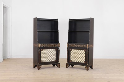 Lot 150 - A pair of Regency-style painted and parcel-gilt wooden waterfall bookcases
