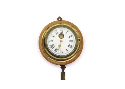 Lot 376 - A brass 'ship' clock