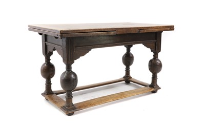 Lot 516 - A Dutch oak draw-leaf table