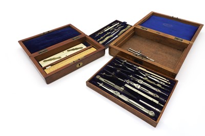 Lot 296 - Two mahogany cased sets of drawing instrument