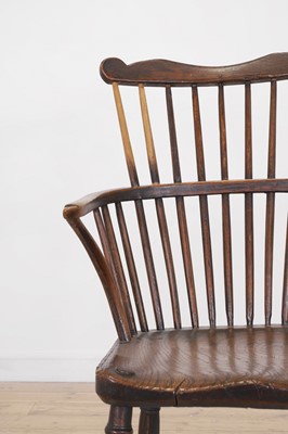 Lot 507 - An ash and elm comb-back Windsor chair