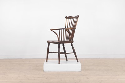 Lot 507 - An ash and elm comb-back Windsor chair