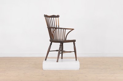 Lot 507 - An ash and elm comb-back Windsor chair