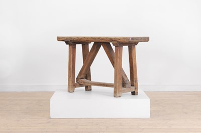 Lot 517 - A vernacular elm trestle table or bench