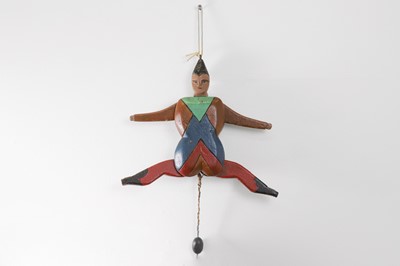 Lot 521 - A folk art carved and painted wood 'Jumping Jack'