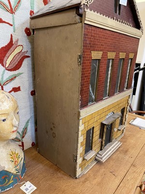 Lot 504 - A William IV painted wooden doll's house