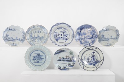 Lot 611 - A group of eight delft and glazed pottery plates